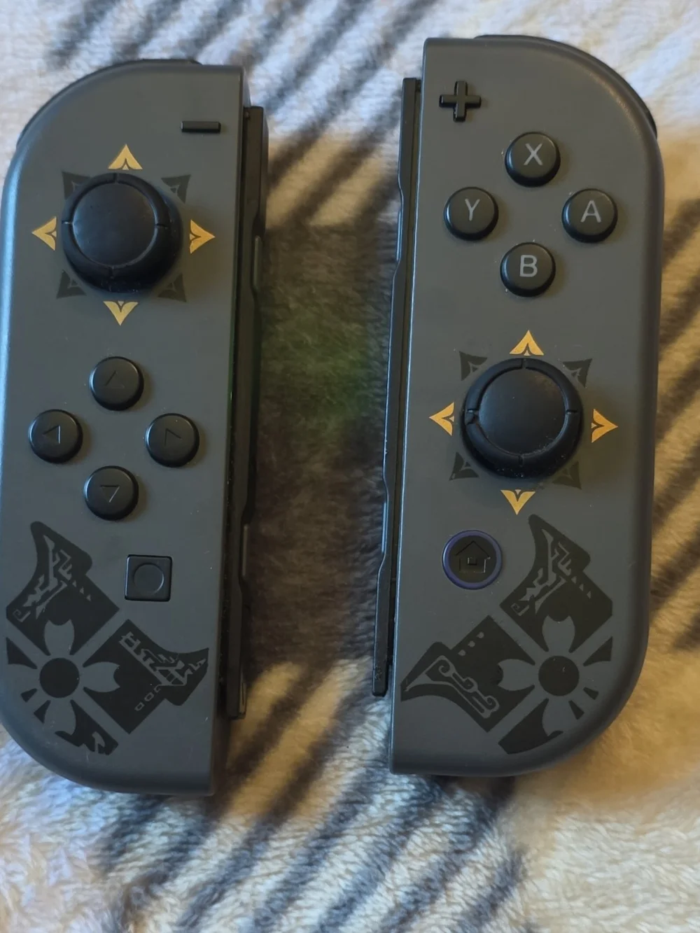 Nintendo Joy-Con Controllers in Dark Gray with Gold Accents